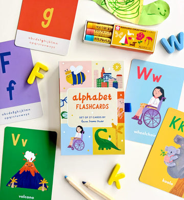 A set of 27 beautifully illustrated alphabet flashcards in a premium keepsake box, featuring vibrant designs with letters, animals, and nature, plus a bonus card with positive affirmations.