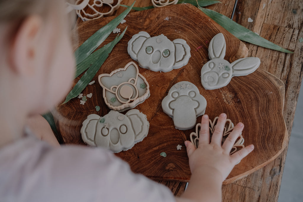 Child playing with Kinfolk Pantry Aussie animal cutters and playdough.
