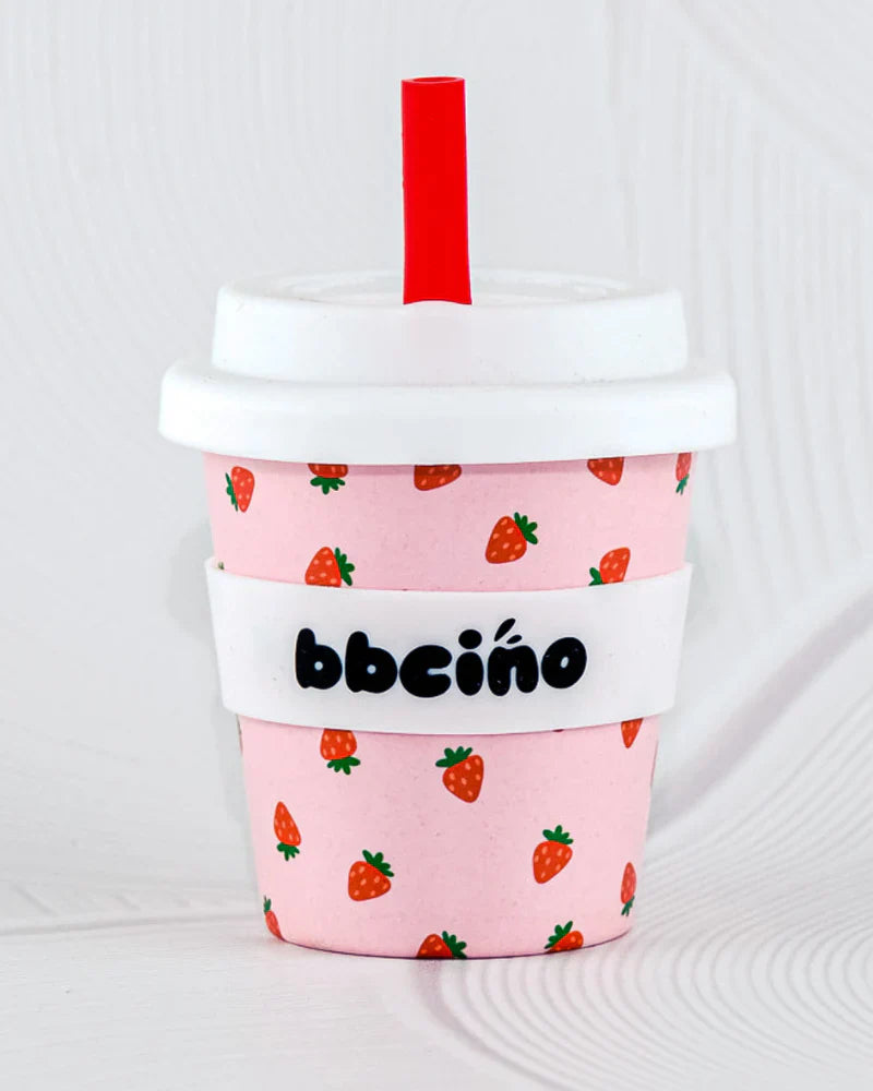 BBCino 120ml reusable cup in a pink and red strawberry design, made from sustainable bamboo. Lightweight, durable, and perfect for babycinos, espressos, or small drinks.