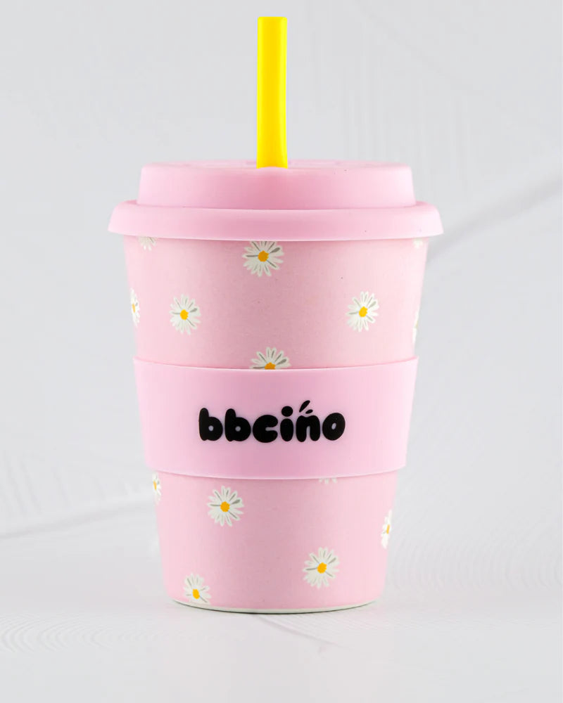 BBCino 350ml reusable cup in Baby Pink with a Daisy design, made from sustainable bamboo. Includes a reusable silicone straw, perfect for large coffees, smoothies, or iced drinks.