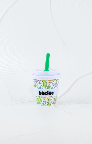 BBCino reusable bamboo cup 120ml in Sipasaurus dinosaur print with white silicone lid and green straw, eco-friendly kids keep cup.