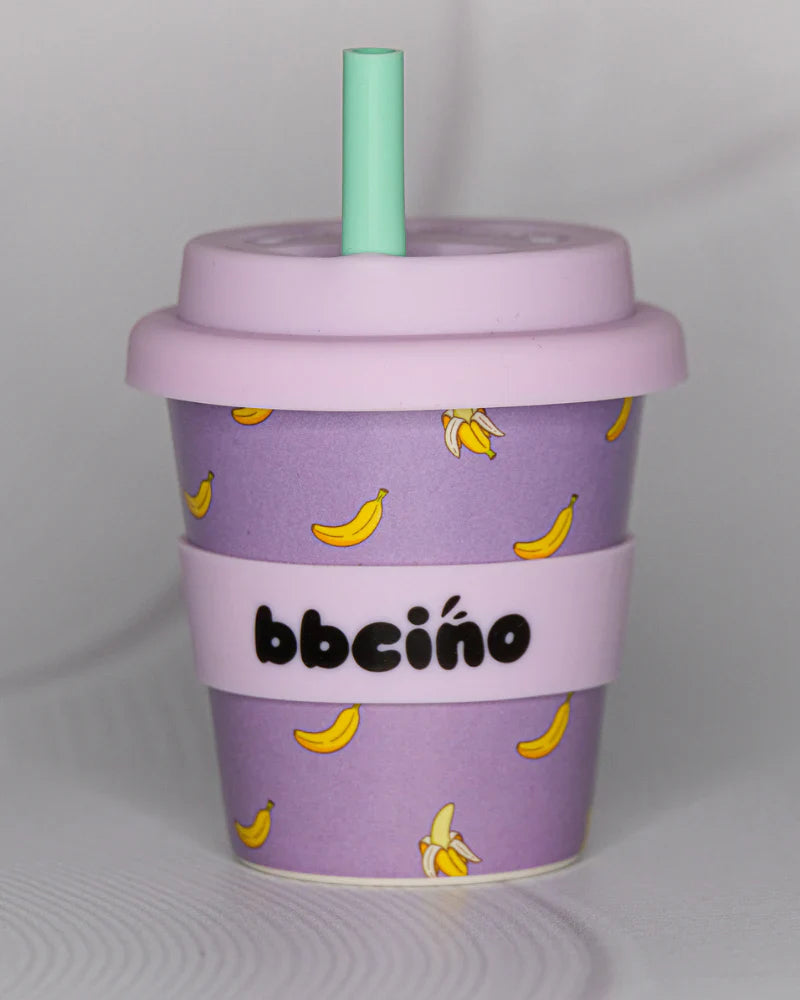 BBCino 120ml reusable cup in purple with a Banana design, made from sustainable bamboo. Lightweight, durable, and perfect for babycinos, espressos, or small drinks.