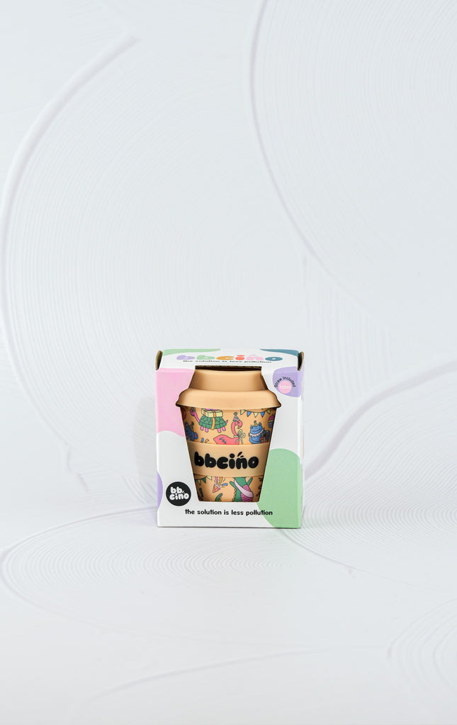 BBCino Party Animal in Orange reusable cup 120ml with fun animal party print and orange lid, sustainable bamboo fibre babycino cup in eco packaging.