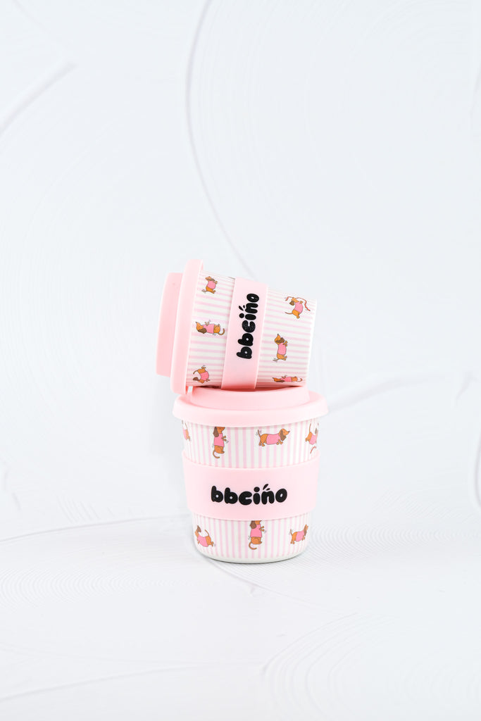 Pair of BBCino reusable bamboo cups 120ml in Dash in Pink dachshund design with pastel pink lids, eco-friendly reusable kids cups.