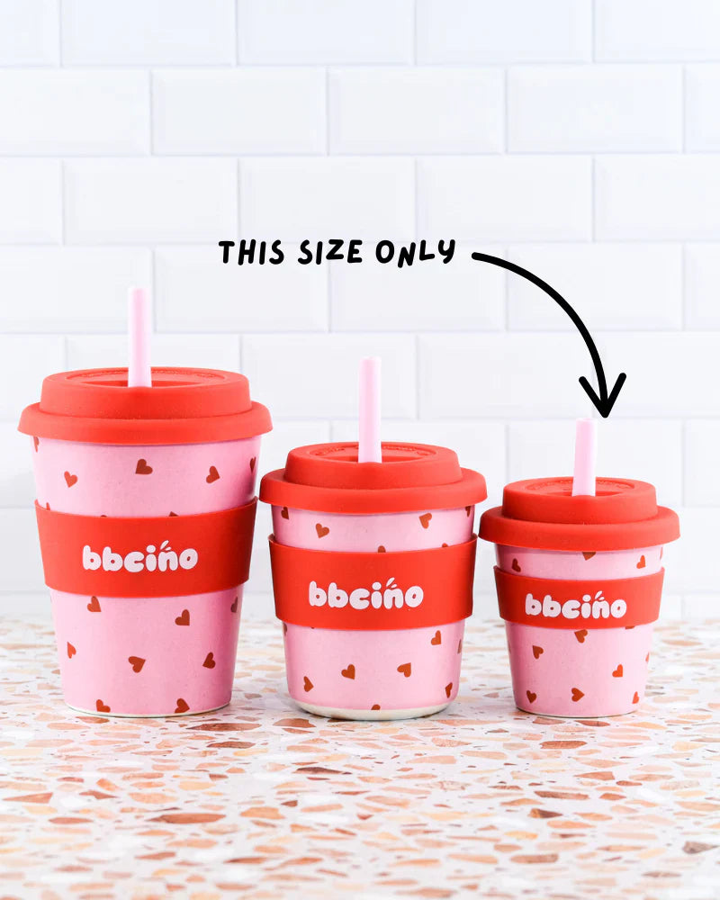 Set of reusable bamboo kids’ cups with red and pink heart design, perfect for babycinos, milkshakes or juice.