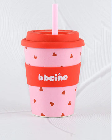 BBCino 350ml reusable cup with a pink and red heart design, made from sustainable bamboo. Includes a reusable silicone straw, perfect for large coffees, smoothies, or iced drinks.