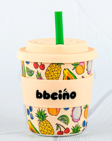 BBCino BambinoCino 240ml reusable cup with a tropical fruit design, made from sustainable bamboo. Lightweight, durable, with a rounded base to prevent tipping, perfect for hot or cold drinks.