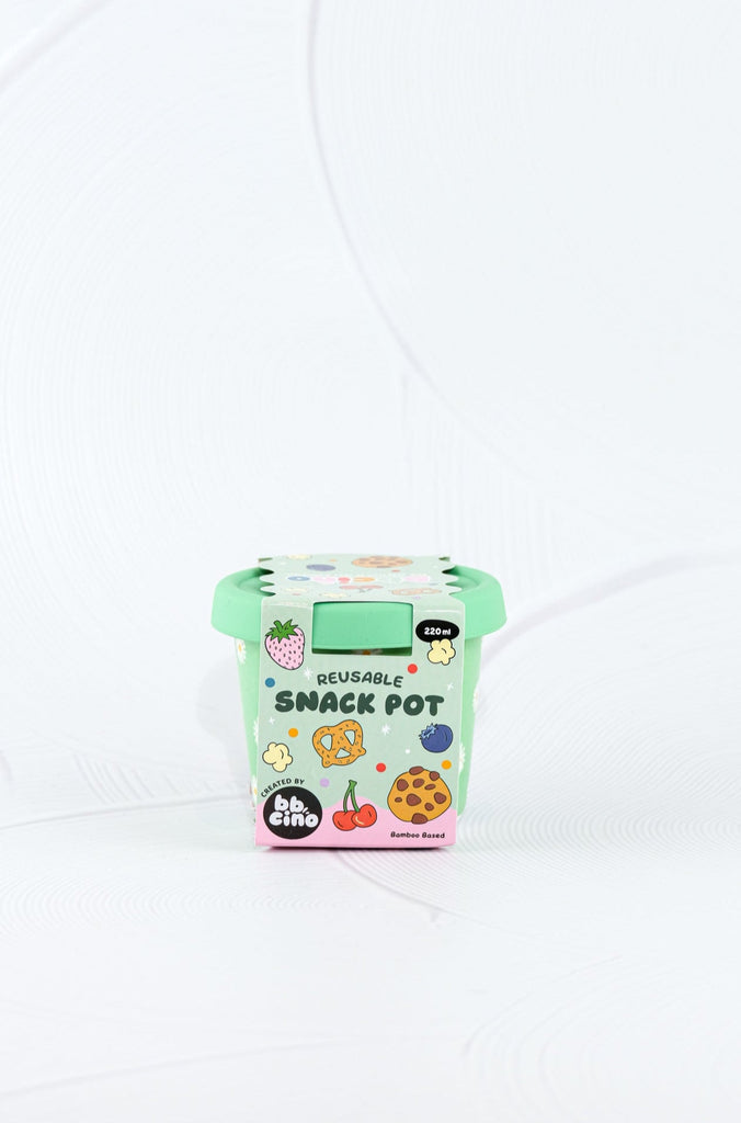 BBCino bamboo reusable snack pot in Daisy BB design with green base and white daisy print, sustainable eco-friendly container with silicone lid in retail packaging.