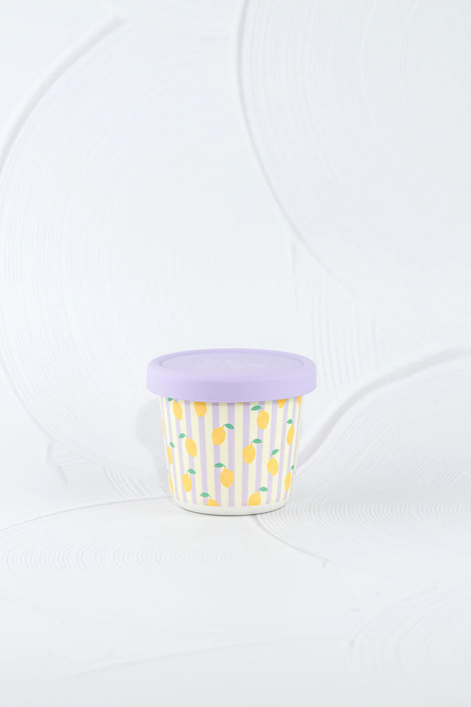 BBCino eco-friendly bamboo snack pot with yellow lemon print and pastel purple silicone lid, lightweight and durable sustainable food container.