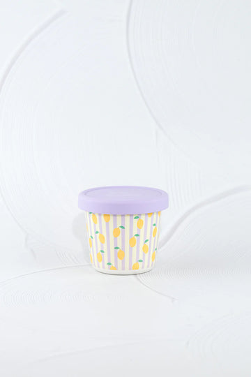 BBCino eco-friendly bamboo snack pot with yellow lemon print and pastel purple silicone lid, lightweight and durable sustainable food container.
