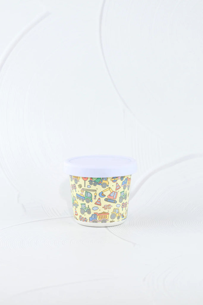 BBCino Dig It bamboo reusable snack pot with construction vehicle print and pastel silicone lid, eco-friendly container for kids’ snacks and lunches.