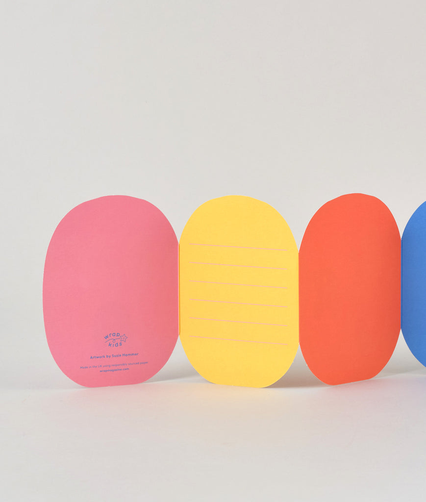 Back view of the fold-out caterpillar card showing plain coloured segments and fold lines, ready for writing a personal message.