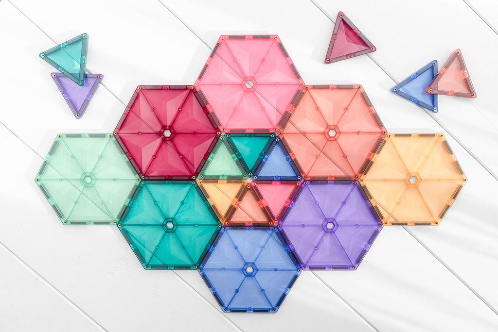A symmetrical heart-like structure made from pastel tiles, featuring triangles and hexagons in multiple soft colours.