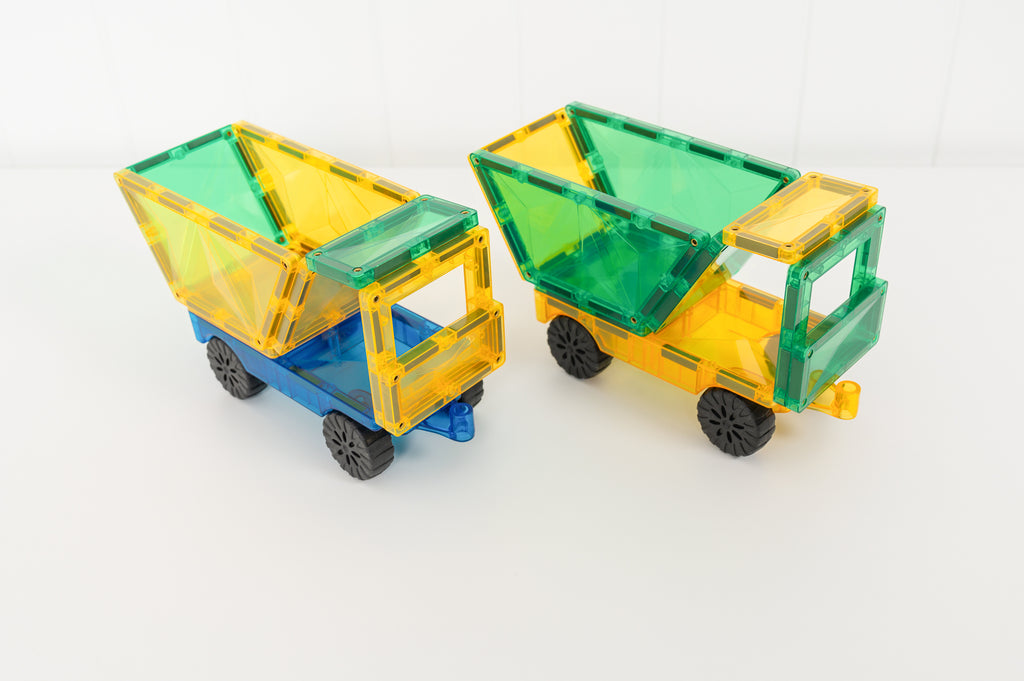 Green and yellow magnetic tile cars assembled on Connetix car bases, with windows and structural pieces added.