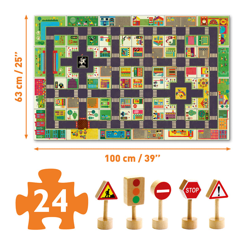 Flat lay of Djeco City Road puzzle showing the full 100 cm play mat layout, 24 interlocking pieces, and 5 wooden traffic accessories including stop signs and lights.