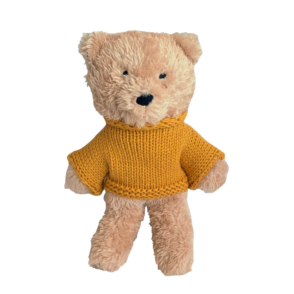 Medium Dulcie Bear plush toy made from soft creamy vanilla plush fabric, dressed in a cozy mustard yellow knitted Australian merino wool jumper, standing upright against a white background.