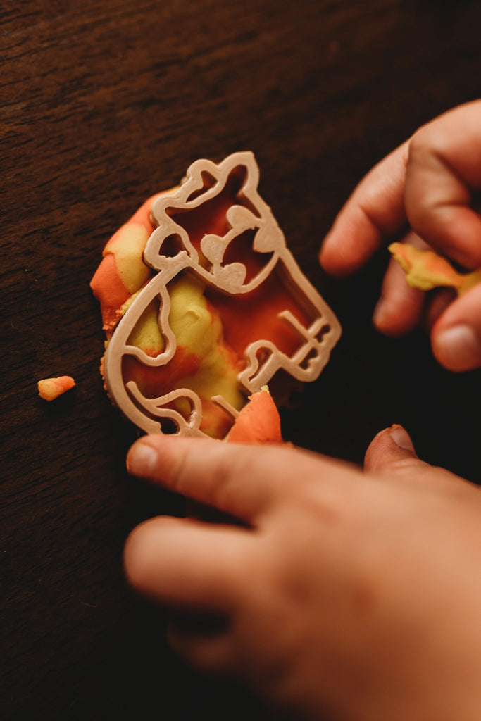 Close-up of cow cutters made from recycled sawdust and PLA, perfect for small hands and sensory play.