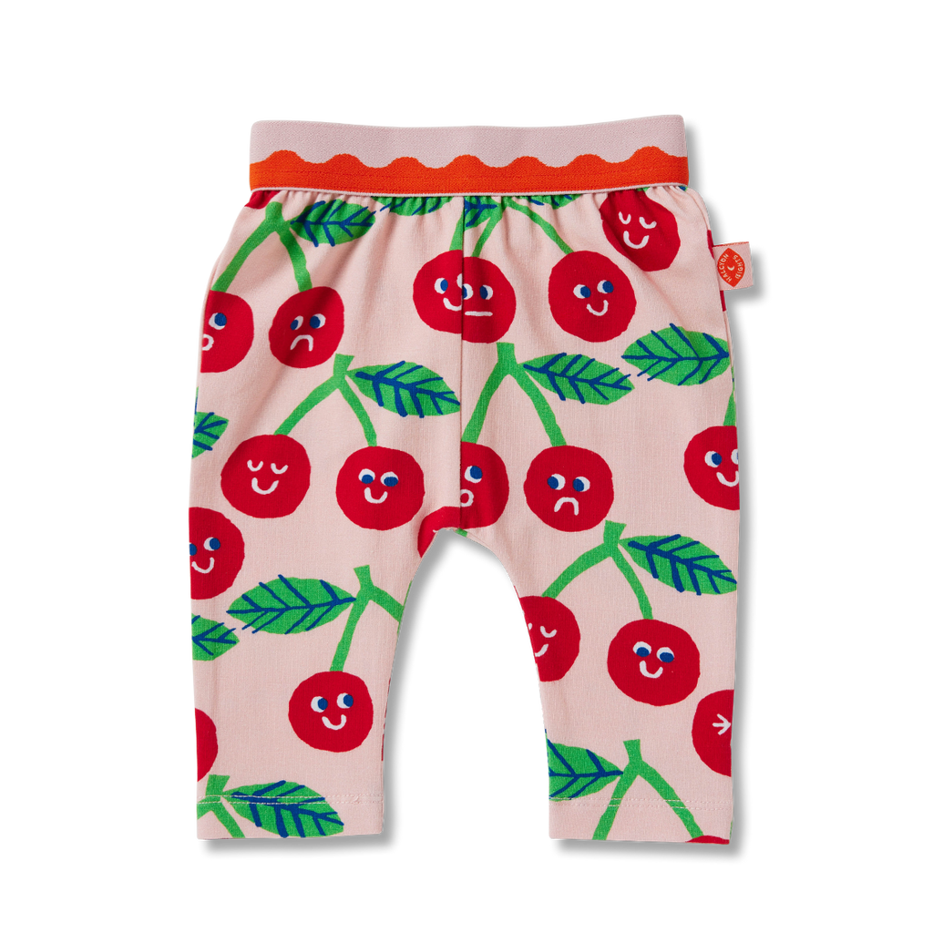 Flat lay of Halcyon Nights Cheeky Cherry baby leggings with red cherry and green leaf print, footless design, and elastic waistband for comfort.