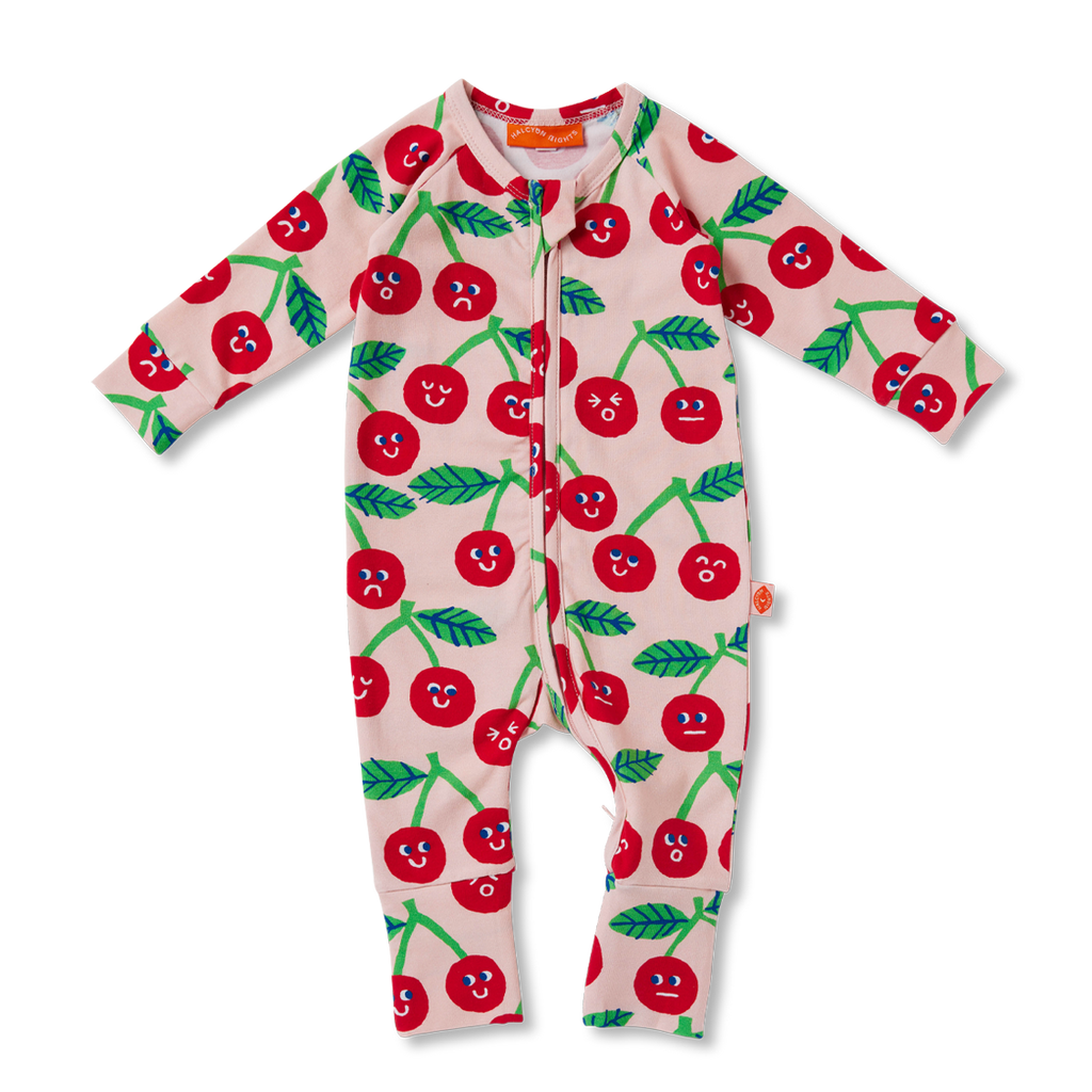 Flat lay of Halcyon Nights Cheeky Cherry long sleeve baby romper with vibrant red cherry print, fold-over foot cuffs, and two-way zip closure.