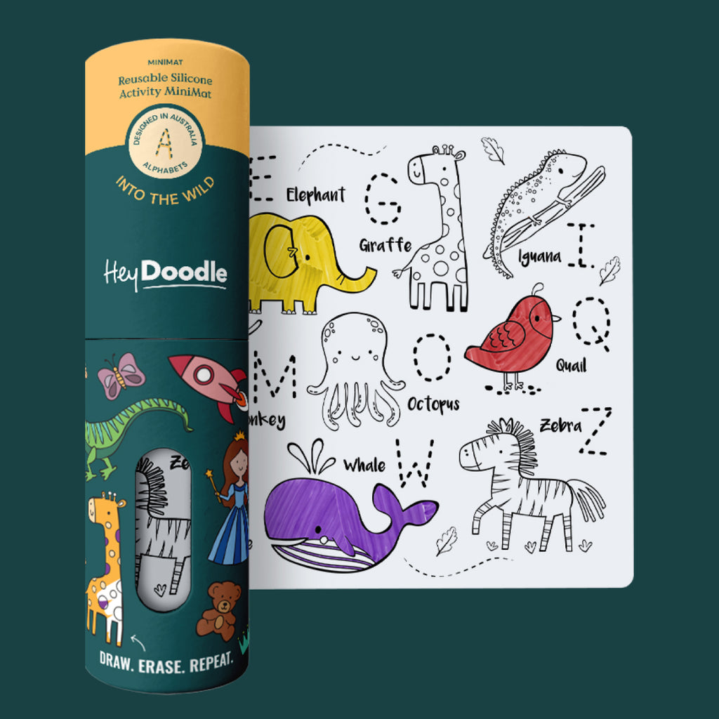 Flat lay of HeyDoodle Into the Wild mini mat in packaging with reusable pens, featuring animal-themed alphabet illustrations.