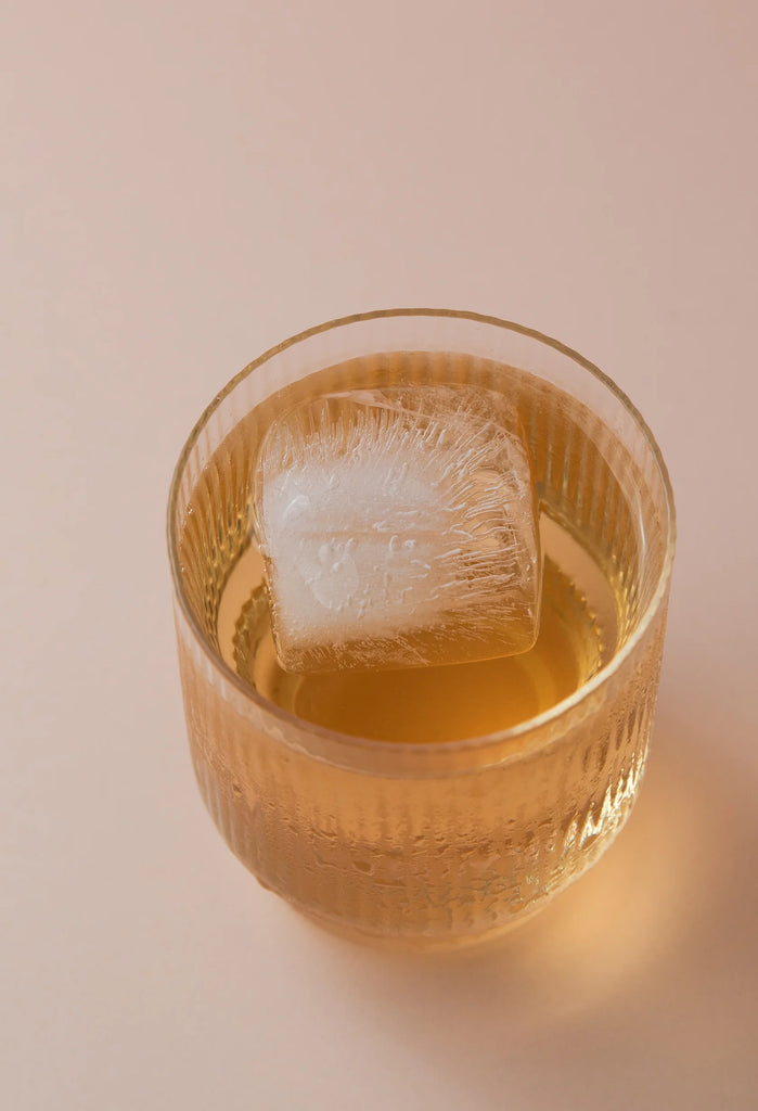 Hydramama Peach Iced Tea Hydration Electrolyte Drink for Pregnancy & Postpartum - Drink featured with cube of ice