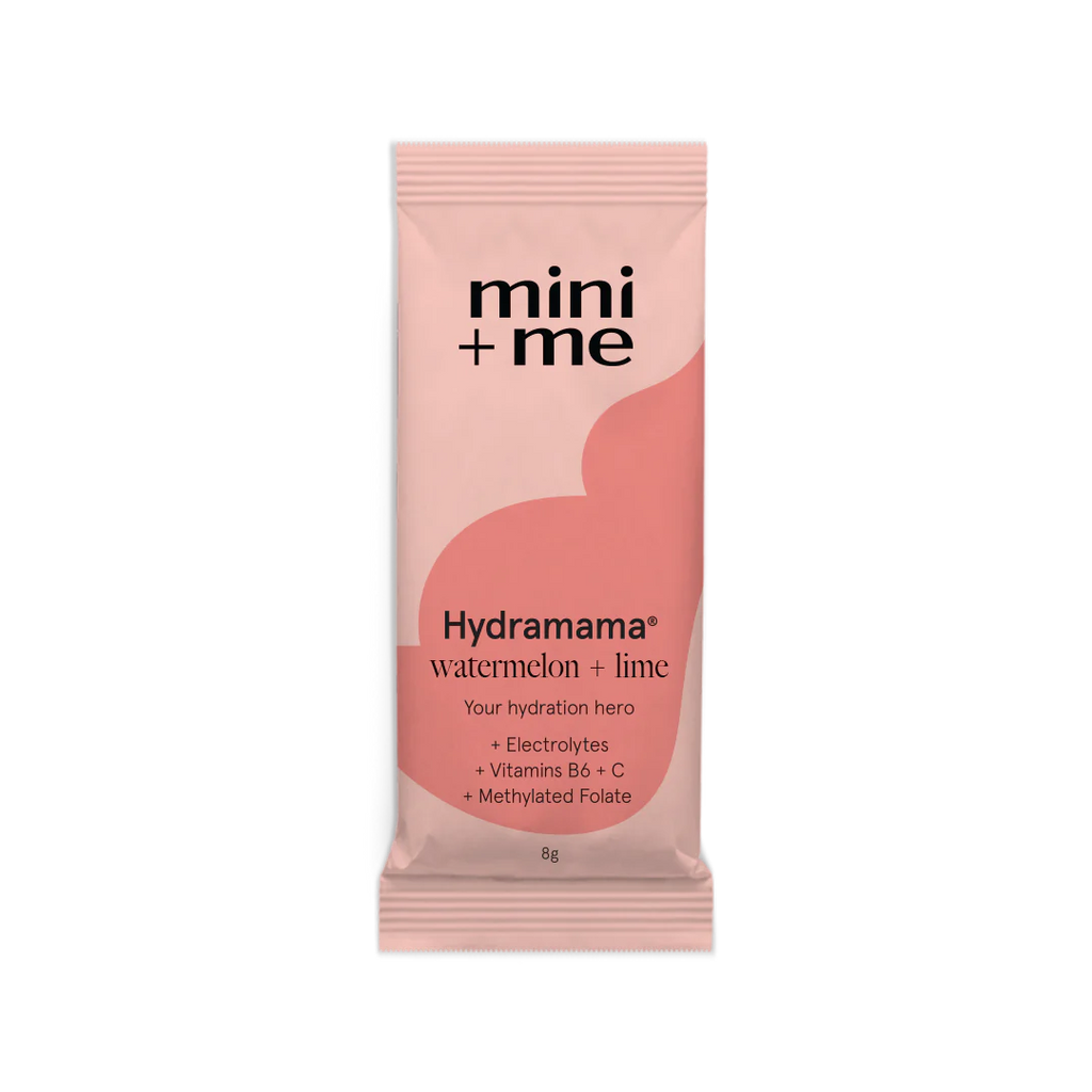 Close-up of Mini + Me Hydramama Watermelon & Lime hydration sachet, featuring product label and pink packaging.