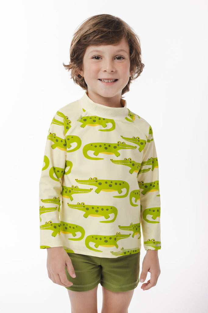 Vibrant crocodile-print rash shirt with UPF 50+ protection, a high neck for extra sun coverage, and a zip-free comfy fit. Perfect for bold, sun-safe water adventures.