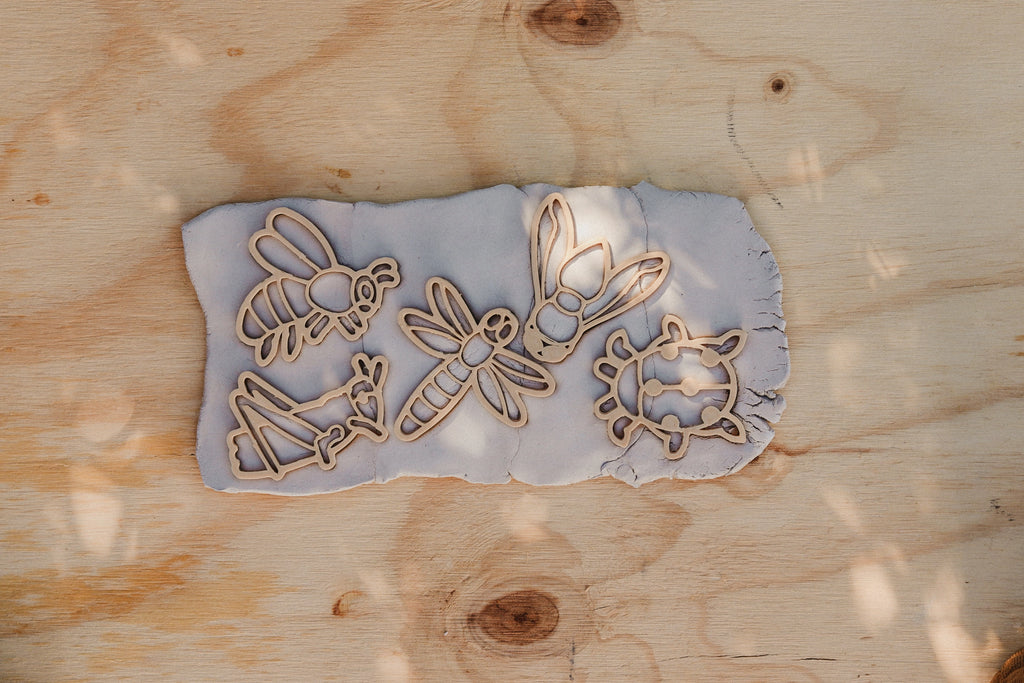 Biodegradable insect-themed dough cutters styled with natural playdough and bug playdough cutters.