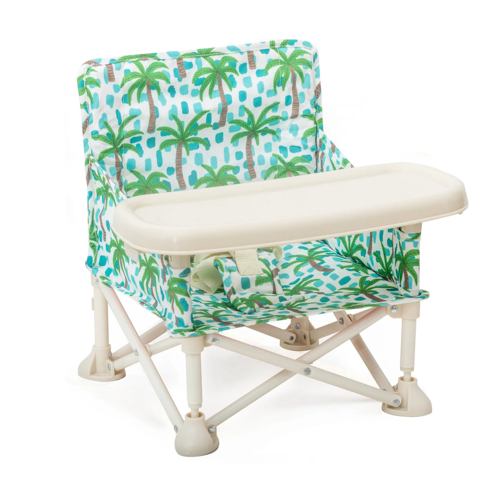 Izimini Baby Chair Kai with tropical palm print fabric and detachable tray – lightweight and foldable baby feeding chair.