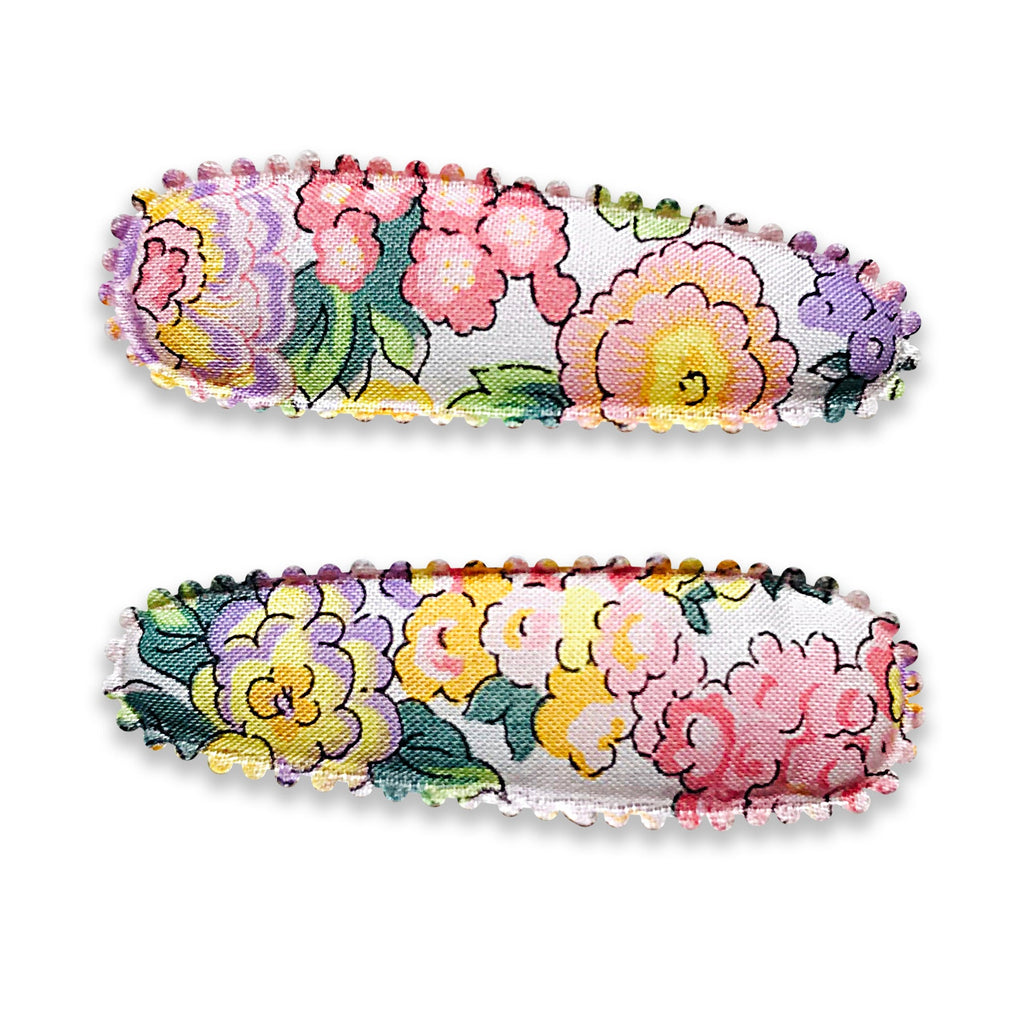 Set of two Josie Joans fabric-covered snap clips featuring a colourful vintage-style floral print with scalloped edging.