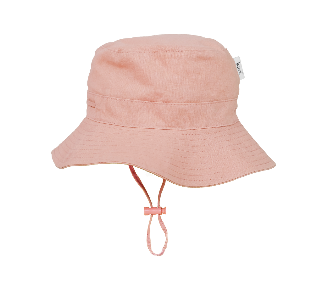 Dusty Rose Kiin Baby sun hat with a wide brim and breakaway safety clip. Made from 100% cotton with adjustable toggles for a secure fit, providing UPF 50+ excellent sun protection. Perfect for babies and toddlers.