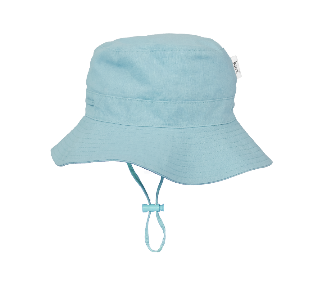 Blue Mist Kiin Baby sun hat with a wide brim and breakaway safety clip. Made from 100% cotton with adjustable toggles for a secure fit, providing UPF 50+ excellent sun protection. Perfect for babies and toddlers.