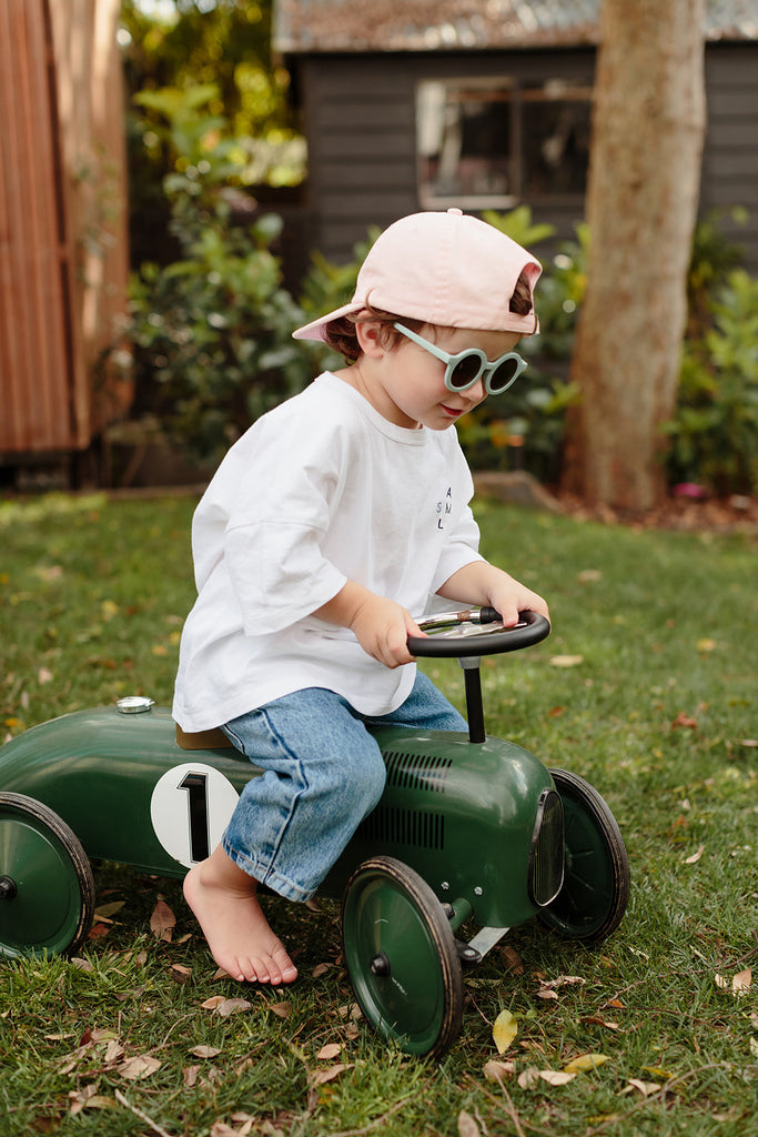 Kids wearing sky-blue Little Drop sunglasses featuring round frames and UV-protective lenses, styled for outdoor play.