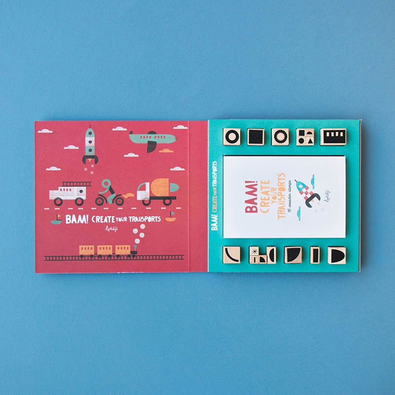 Open Londji BAM! Create Your Transports box showing booklet and wooden stamps arranged neatly inside.