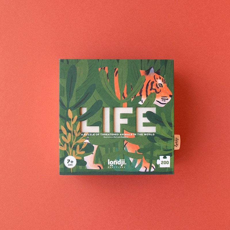Front of Londji Life Puzzle box featuring illustrated green jungle leaves and a tiger peeking through.