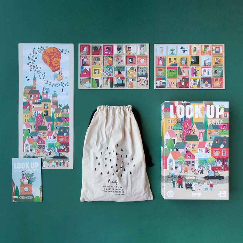 Complete Londji Look Up puzzle set with box, puzzle bag, and illustrated guide on a green background.
