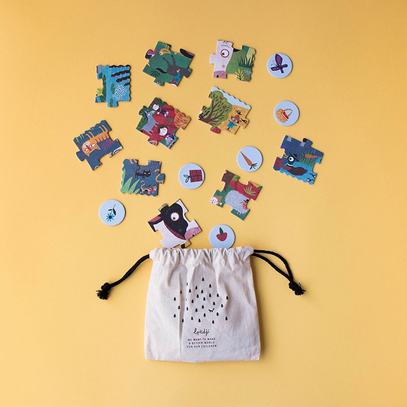 Puzzle pieces and round tokens from Londji’s My Little Farm Look & Find Pocket Puzzle spilling from a cotton drawstring bag.