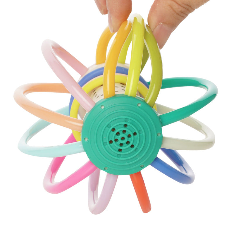Close-up of Whistleball Colorpop’s green base with pastel plastic tubes splayed out, highlighting the safe, BPA-free construction for newborns.