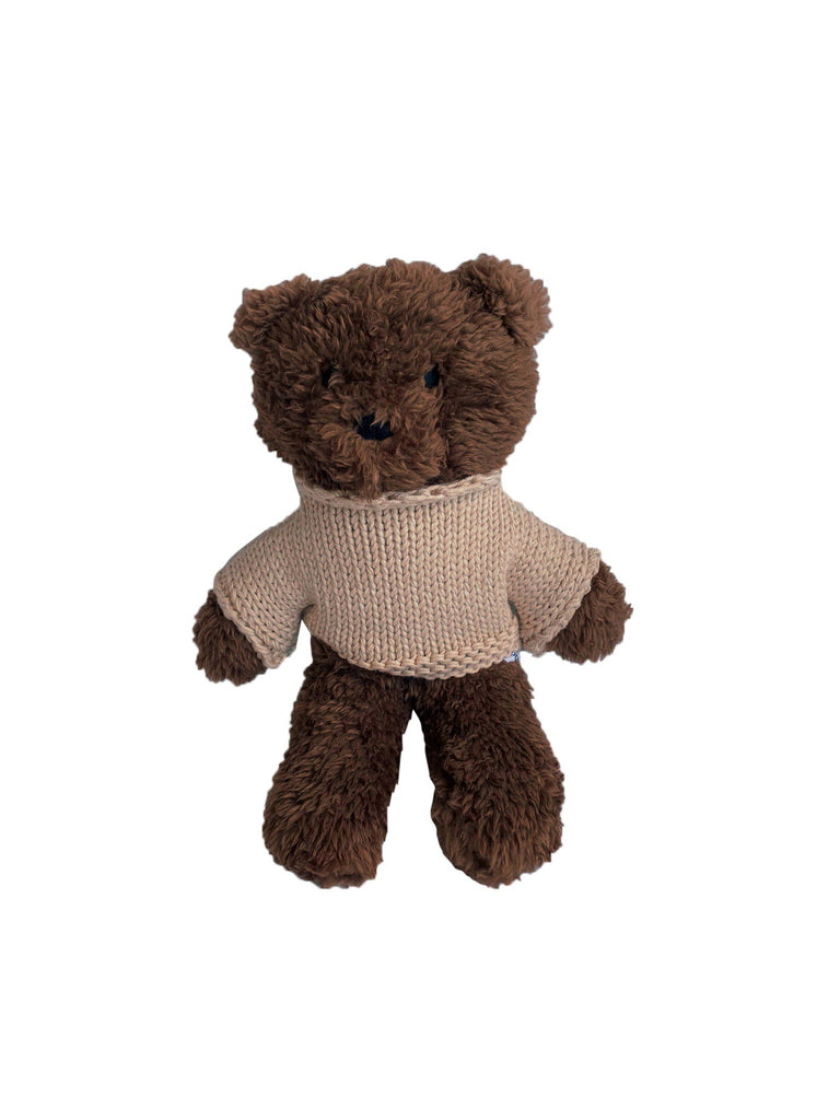 Mini Milo Bear plush toy made from soft chocolate brown plush fabric, wearing a cozy cream knitted Australian merino wool jumper, standing upright against a white background.