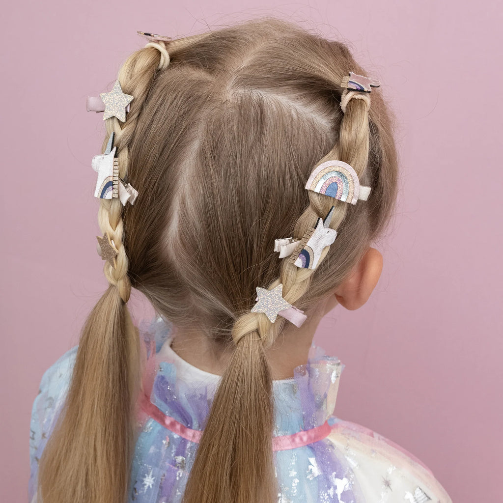 Back view of braided hairstyle decorated with Mimi & Lula Celeste Mini Clips featuring unicorns, stars, and rainbows.