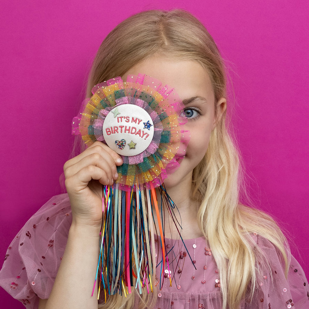 Cute girls’ birthday badge by Mimi & Lula featuring colorful layered tulle and shiny ribbons