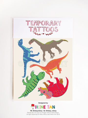 Sheet of colourful temporary tattoos featuring playful hand-drawn dinosaurs, including a green T-Rex, blue velociraptor, orange spinosaurus, red triceratops, and other vibrant prehistoric creatures, designed by Missy Minzy.