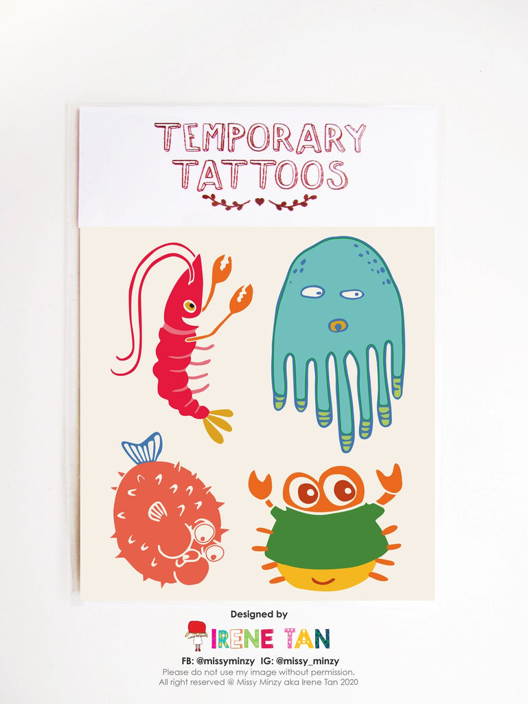 Sheet of quirky underwater-themed temporary tattoos featuring a prawn, pufferfish, octopus, crab, and other funny sea creatures—hand-drawn by Missy Minzy.