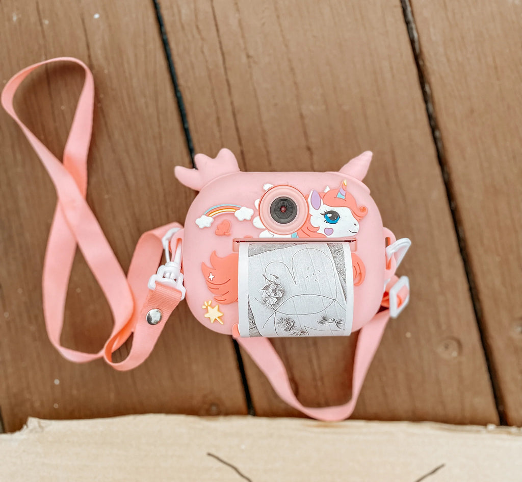 Adorable unicorn instant print camera for kids! Snap, print, and share fun memories instantly. Perfect for creative play and capturing magical moments!