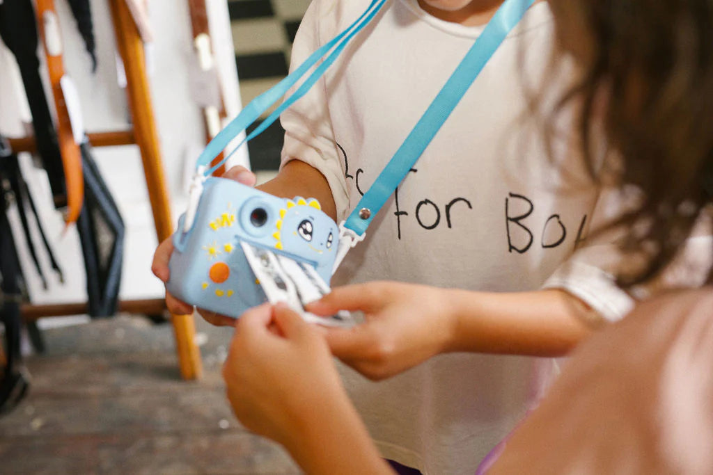 Capture fun moments instantly with the Oh My Frankie Instant Print Camera – a cute, kid-friendly camera that prints photos in seconds!