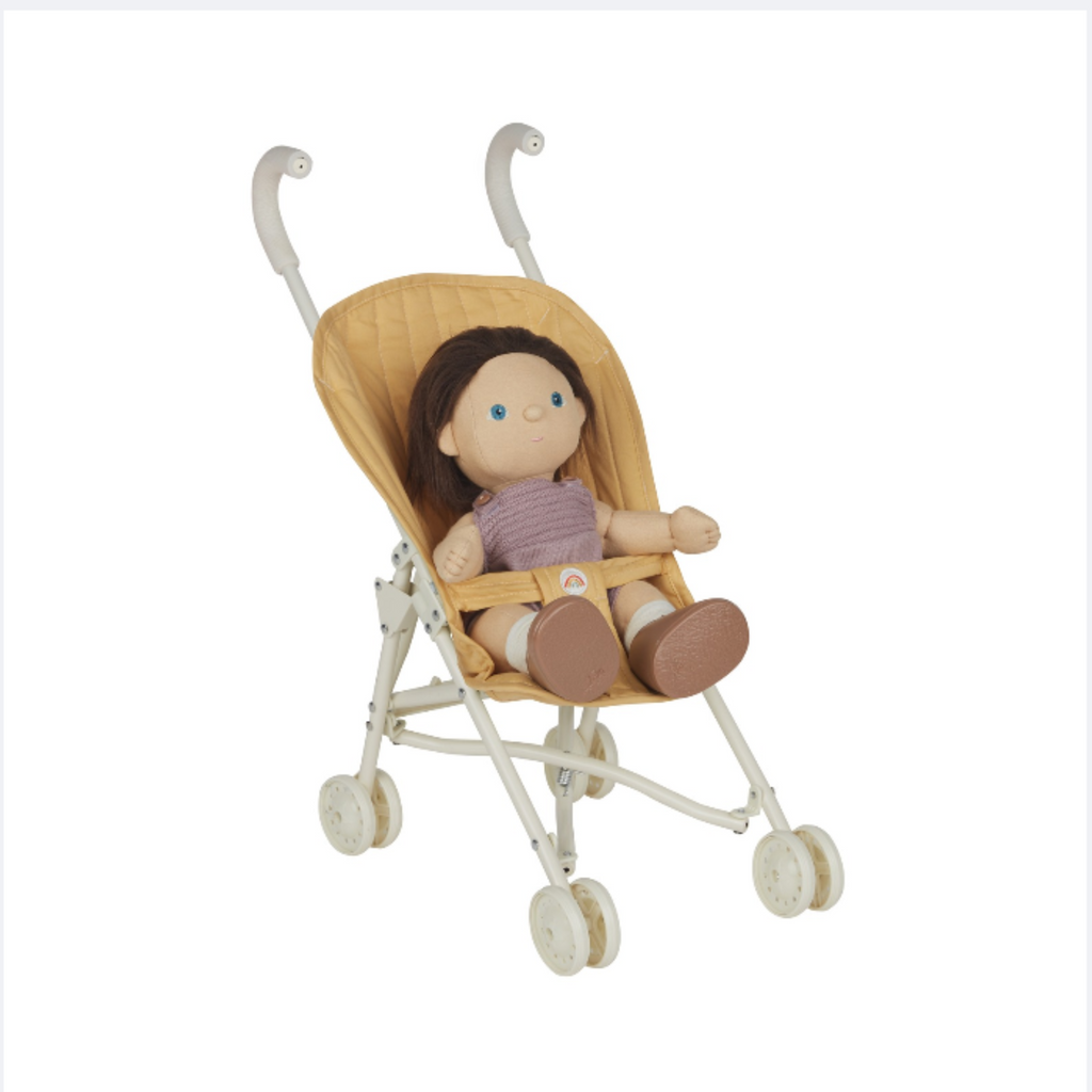Dinkum Doll seated in Sollie Stroller Honey – Plush doll sitting in honey stroller, showing comfort and fit for imaginative play.