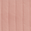 Close-up of quilted rose stroller fabric – Detailed view of soft quilted pink cotton seat texture.