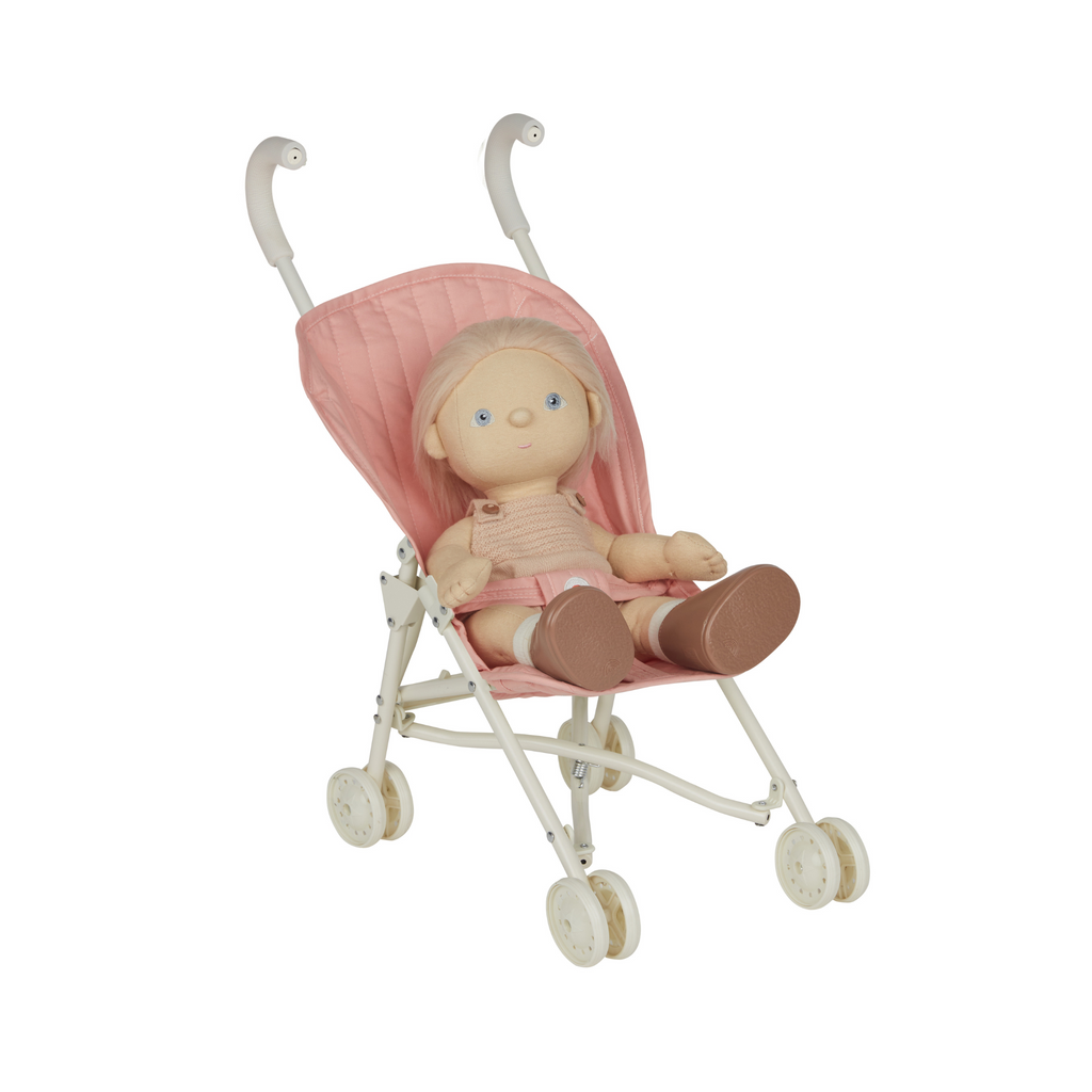 Doll sitting in Sollie Stroller Rose – Plush Dinkum Doll seated in the quilted rose pink stroller, showcasing playtime use.