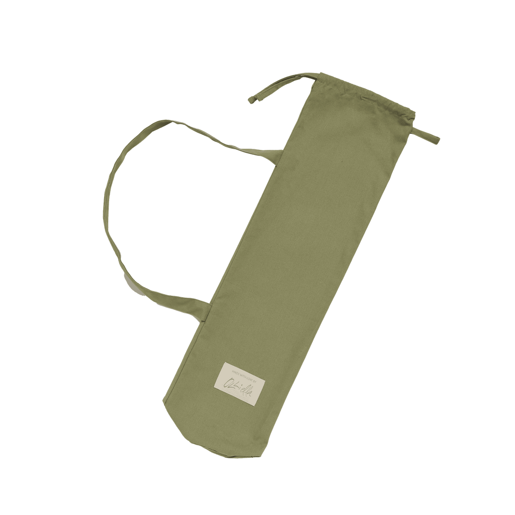 Sollie Stroller Sage stored in matching carry bag – Quilted stroller folded neatly in a sage cotton canvas drawstring bag.