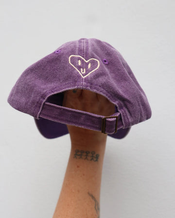 Back view of the purple "Handful" kids cap, featuring a sweet embroidered heart design and adjustable strap for ages 1 to 7—crafted from soft washed cotton.